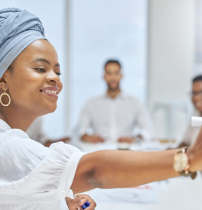 Cropped shot of an attractive young businesswoman giving a presentation in the boardroom.